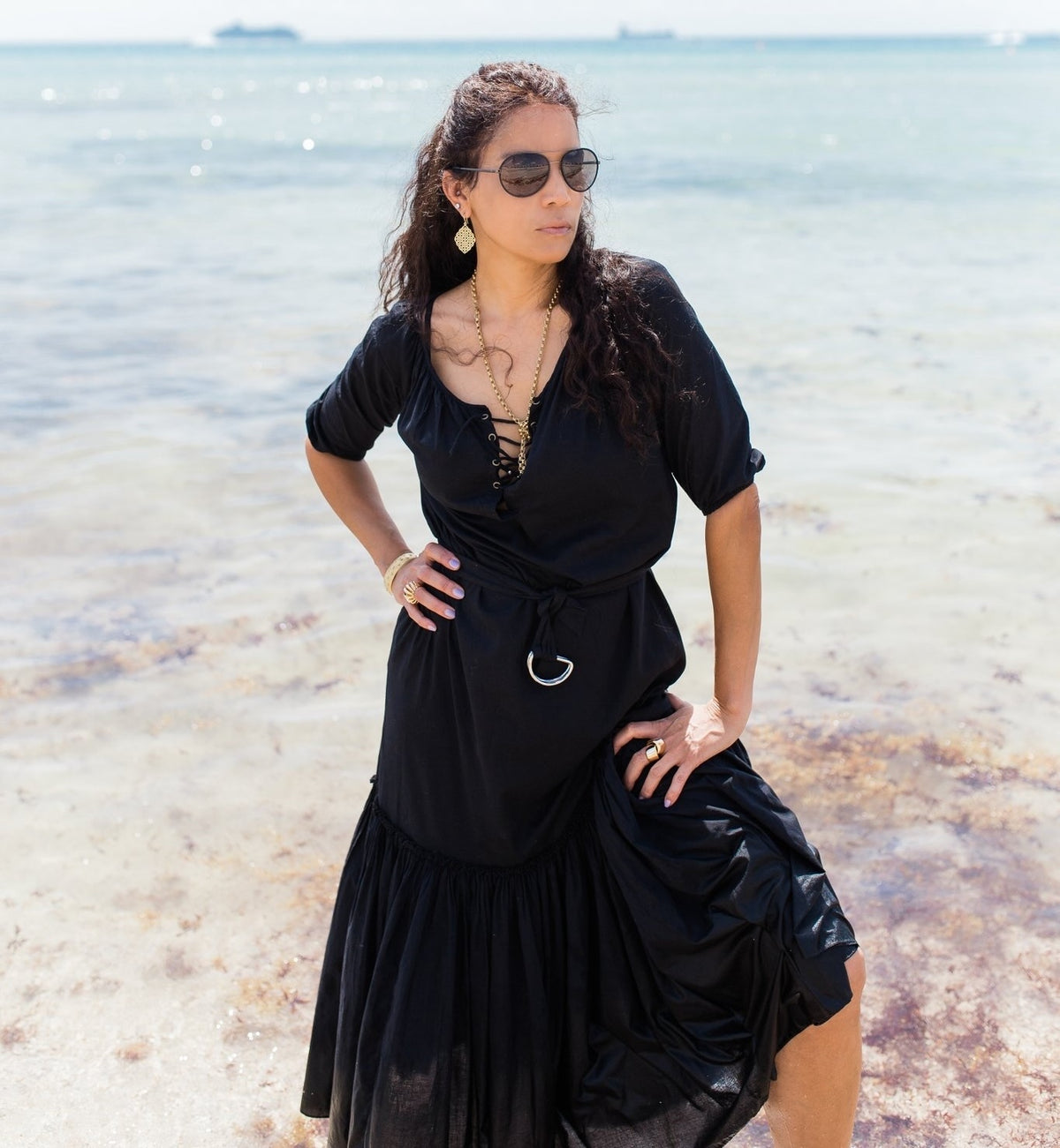 Veronica Webb on the beach in Long black Caftan by Room502