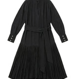 Black pleated dress with long sleeves on a white background