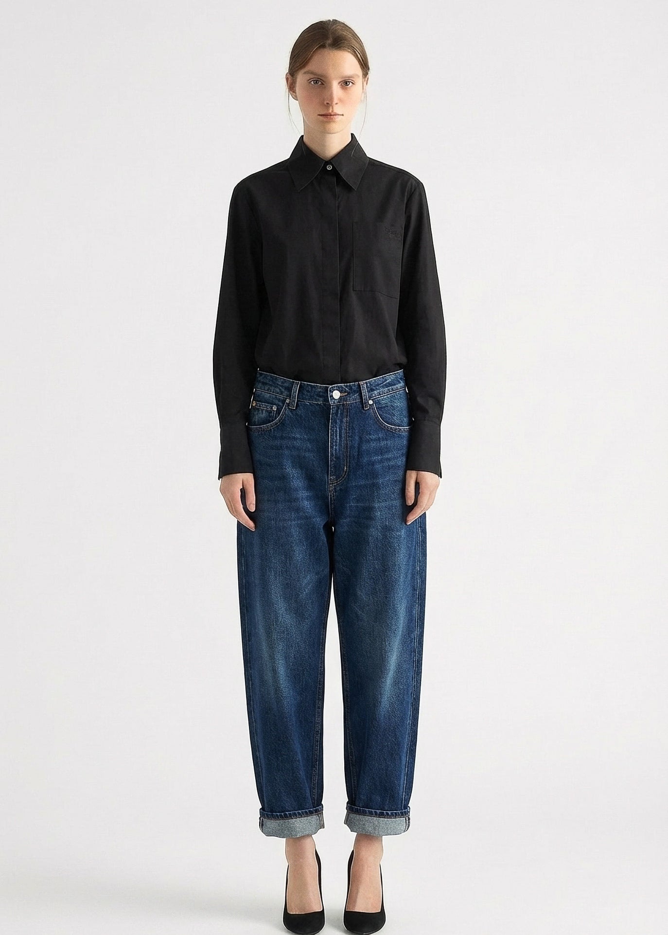 Woman wearing black cotton shirt relaxed fit casual styling