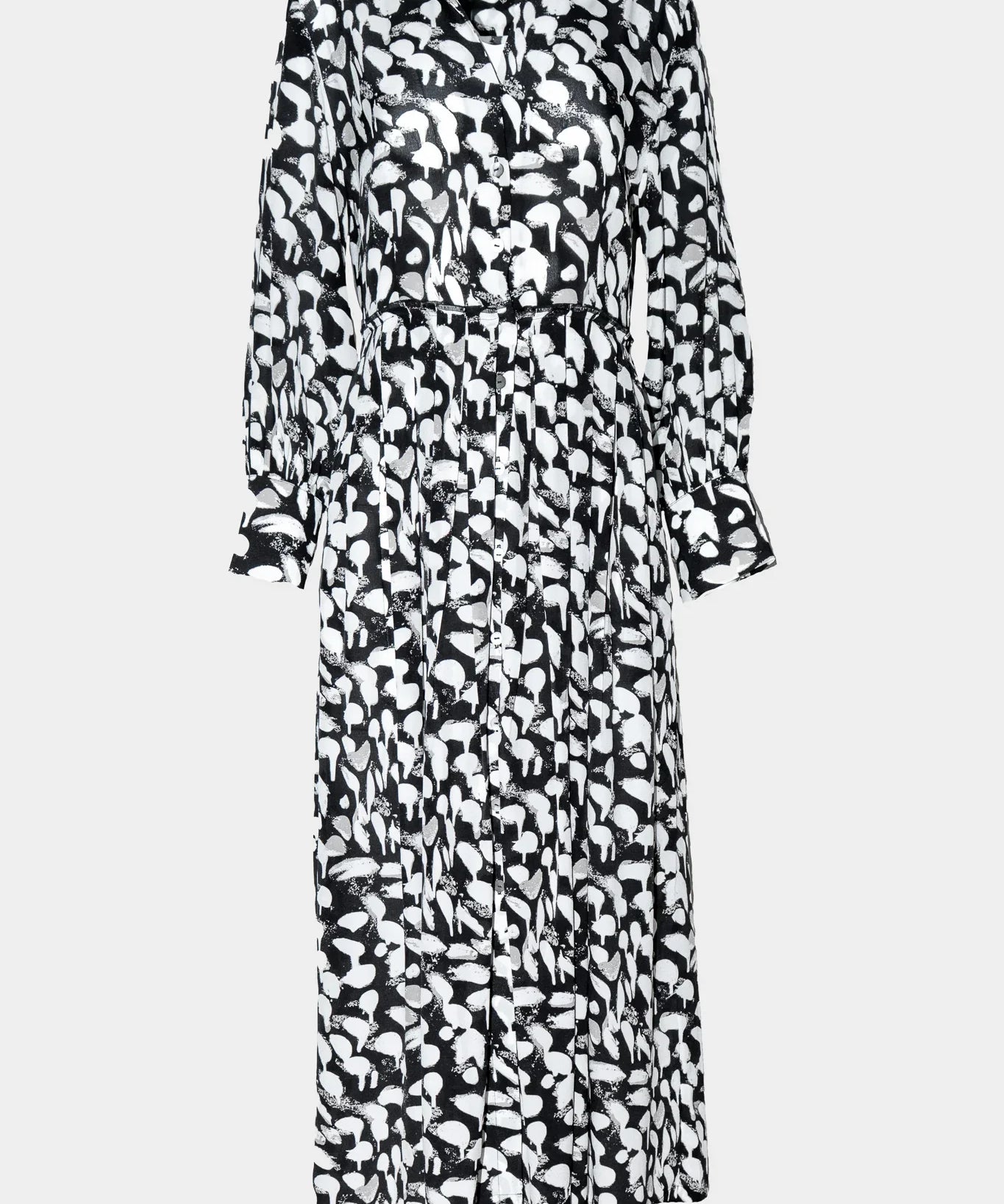 Black and white patterned dress on a light gray background