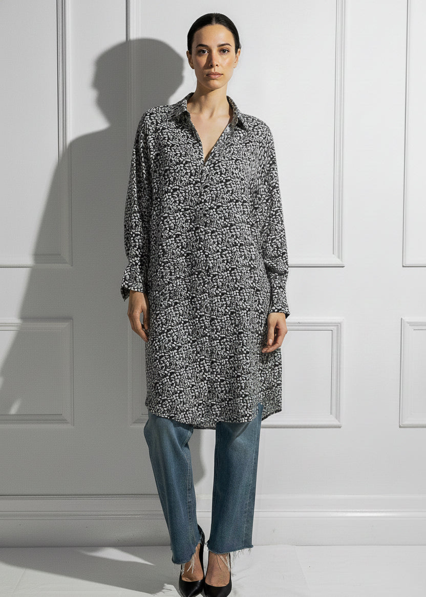 Woman wearing silk print caftan dress oversized fit elegant styling
